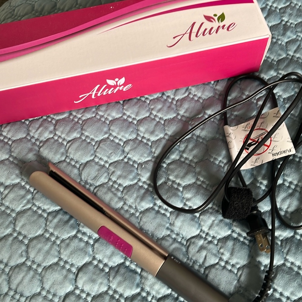 Mini travel hair straightener, and curler.